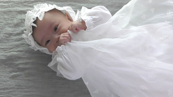 Cute Baby Model Wearing White Baby Dress, Bashful Smile