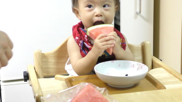 Cute and funny baby eats watermelon rind. She has passed since one month half from the first time to eat watermelon.